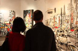 art patrons viewing paintings by Brooke Harker at Jeanie Madsen Gallery