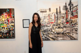 artist Brooke Harker in front of her painting “Grauman’s Chinese Theatre”