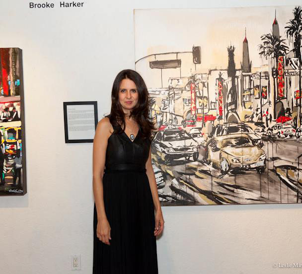 artist Brooke Harker in front of her painting “Grauman’s Chinese Theatre”