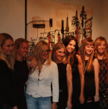 artists of “Women Rock” in front of Brooke Harker’s painting