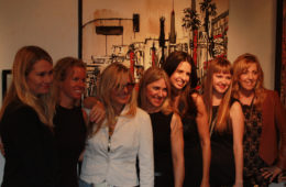 artists of “Women Rock” in front of Brooke Harker’s painting