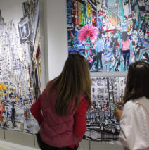 visitors viewing original paintings by Brooke Harker