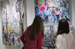 visitors viewing original paintings by Brooke Harker