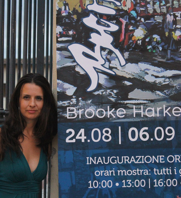 artist Brooke Harker with Italian banner