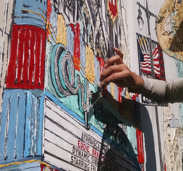 artist painting the Orpheum Theatre in Downtown LA