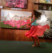 twirling at Lu Martin Galleries in front of Fiori di Roma