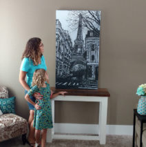 “Dreams of Paris” by Brooke Harker features this mother and daughter