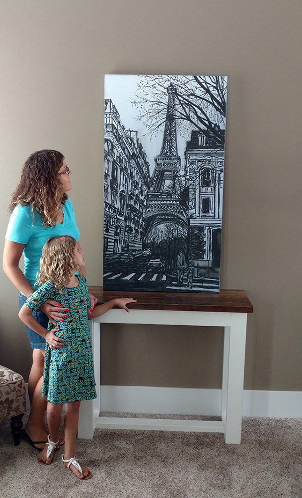 “Dreams of Paris” by Brooke Harker features this mother and daughter