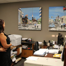 art collectors with paintings in their office by Brooke Harker