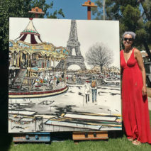 artist Brooke Harker with the finished “La Magie du Carrousel”