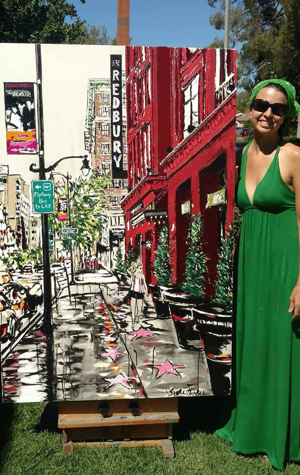 artist Brooke Harker with the finished “Hollywood in Stride”