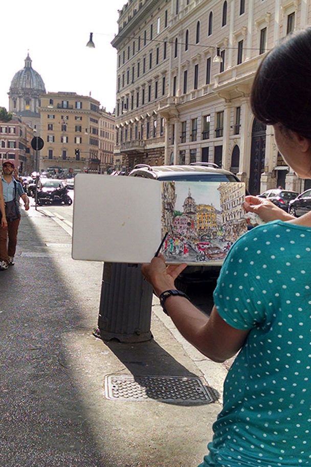 Brooke Harker sketching on the street in Rome