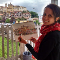 Brooke Harker painting by the train station in Valmontone, Italy