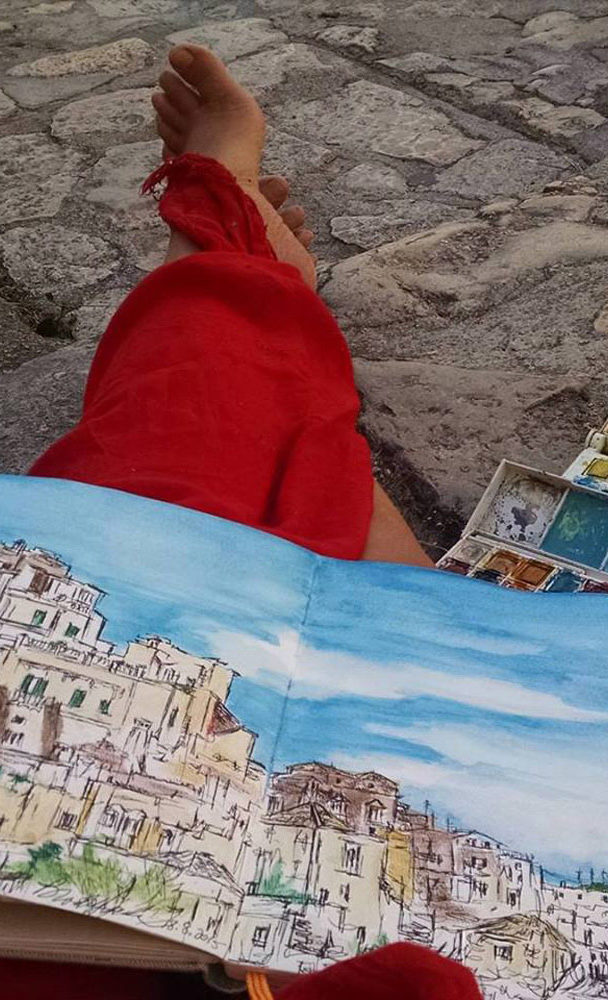 sitting with ink & watercolor paintings in Matera, Italy