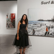 Brooke Harker with paintings at Castelli Artspace’s opening of “Surf & Turf”