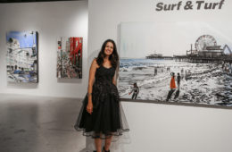 Brooke Harker with paintings at Castelli Artspace’s opening of “Surf & Turf”