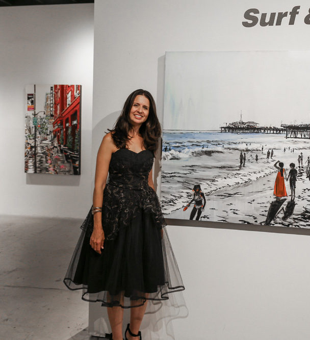 Brooke Harker with paintings at Castelli Artspace’s opening of “Surf & Turf”