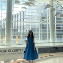 artist Brooke Harker next to the Alexander Calder mobile in the Chase Center