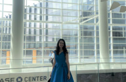 artist Brooke Harker next to the Alexander Calder mobile in the Chase Center