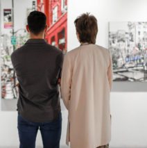 patrons at Castelli Artspace looking at artworks by Harker