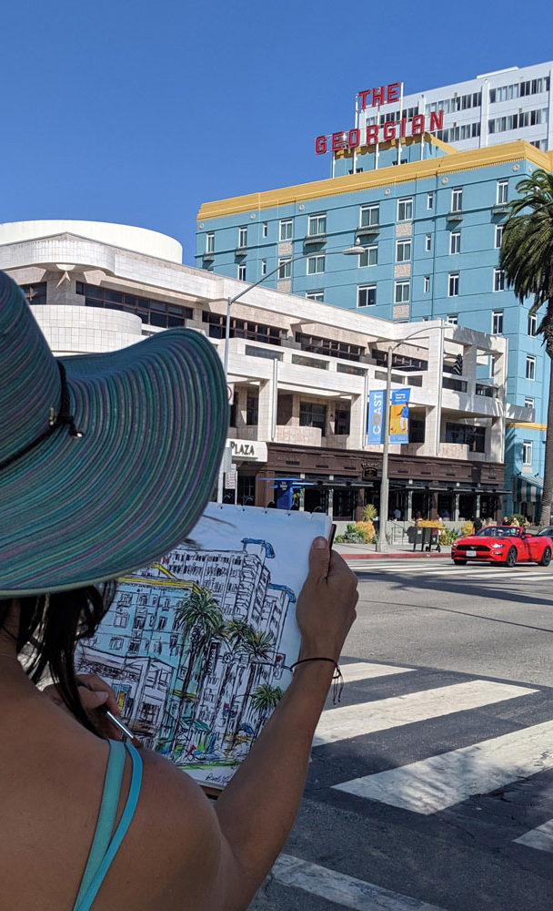 Harker making a watercolor of The Georgian Hotel