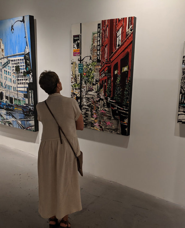 a guest viewing artworks by Harker at Castelli Artspace