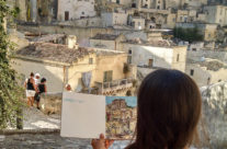 Brooke Harker looking at the first sketch that will inspire “Remembering Matera”