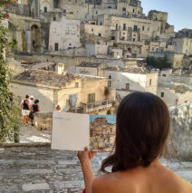 Brooke Harker looking at the first sketch that will inspire “Remembering Matera”