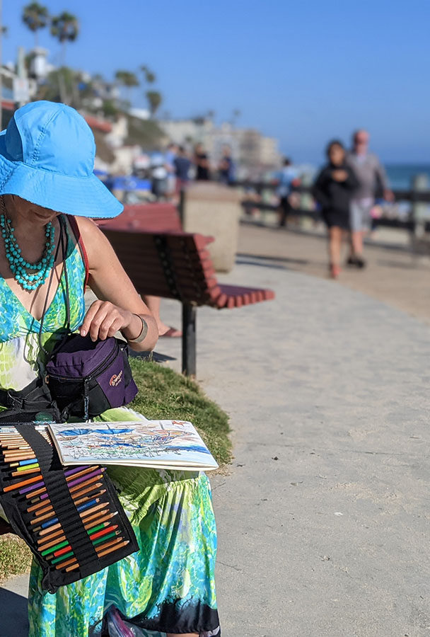 Artist Brooke Harker sketching in Laguna Beach